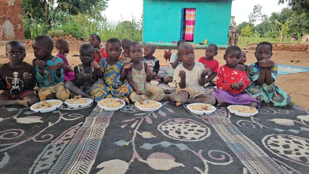 Children sharing meals from a Derma SG food distribution